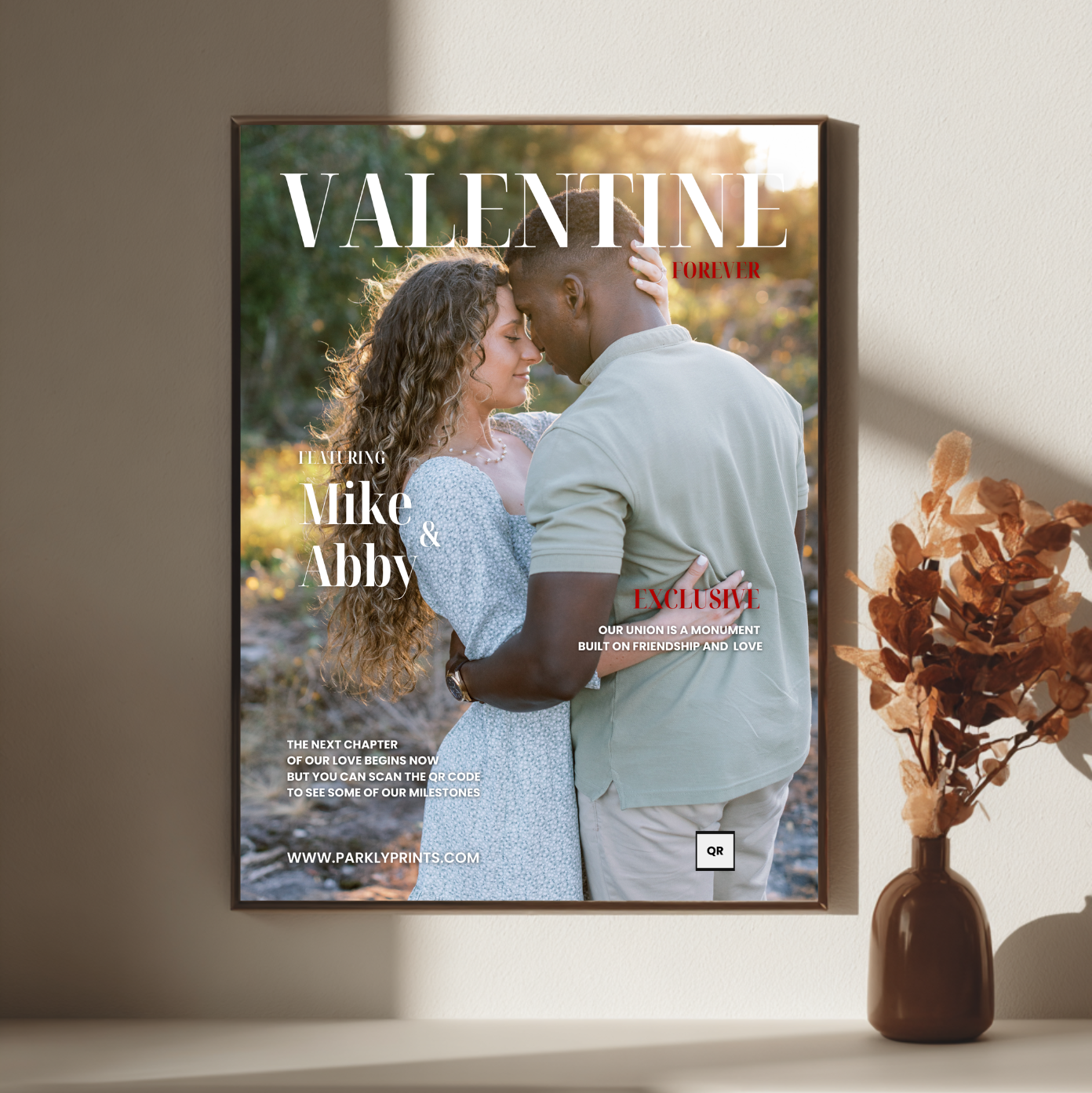 Framed magazine cover with a couple on a wall in a room with a vase.