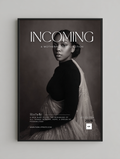 Framed poster with a black and white portrait of a woman and text 'INCOMING' on a gray background.