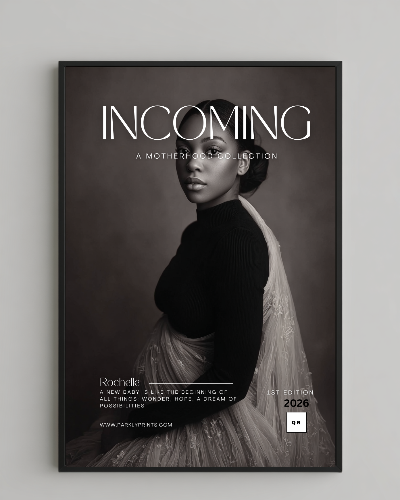 Framed poster with a black and white portrait of a woman and text 'INCOMING' on a gray background.